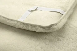 Bettauflage Lammfell olivengegerbt